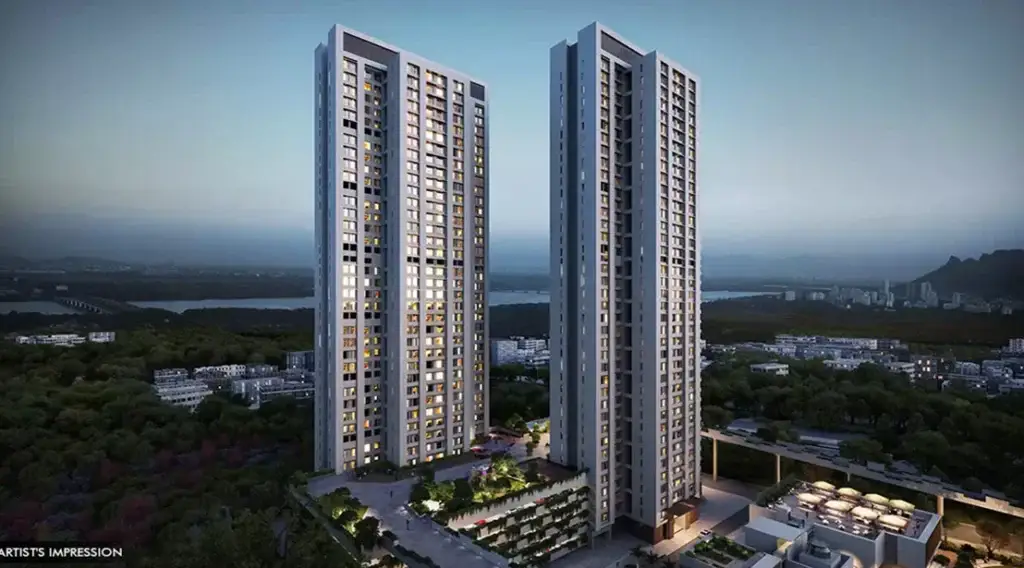 An artist's impression of the modern high-rise towers at Piramal Vaikunth, Thane, featuring illuminated residential luxury apartments surrounded by lush greenery at dusk.